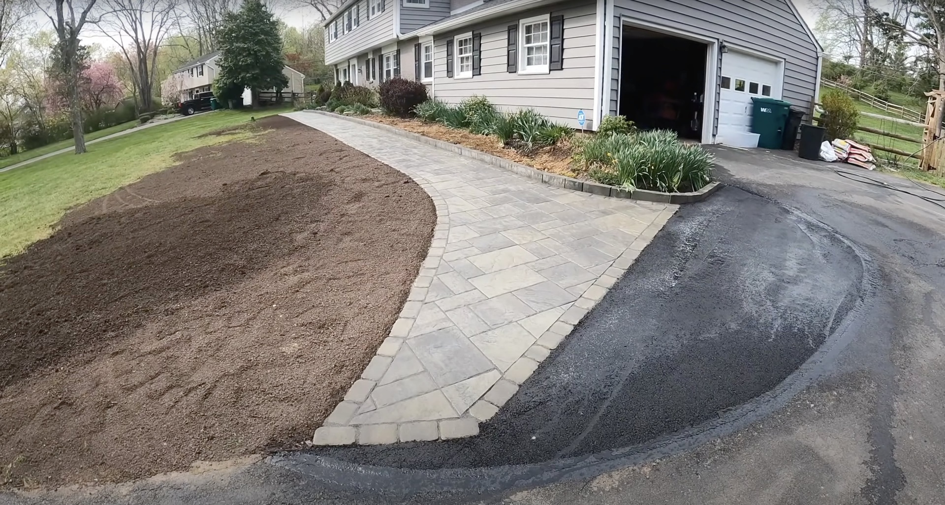 Elegant paver-style concrete walkway and driveway installation at residential home in Henderson, KY
